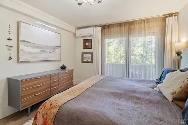 a bed room with a bed and a window