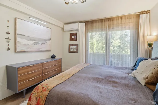 a bed room with a bed and a window