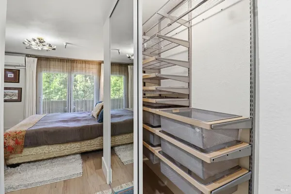 a bathroom with a granite countertop toilet sink and mirror