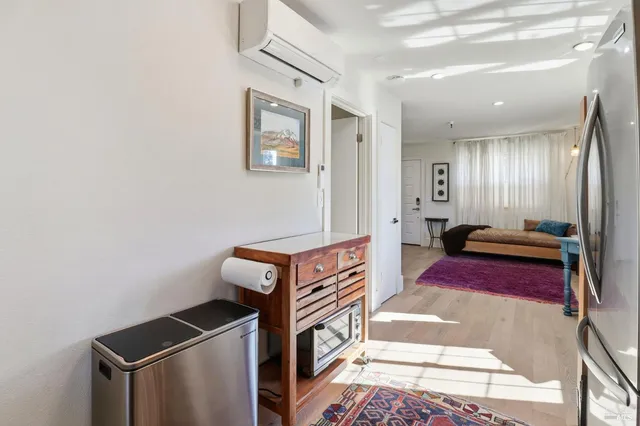 a kitchen with granite countertop cabinets stainless steel appliances a sink and a window