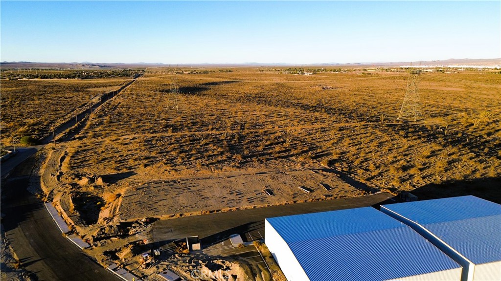 9 Violet Road Adelanto, CA 92301 - Photo 5 of 8 an aerial view of residential houses with outdoor space