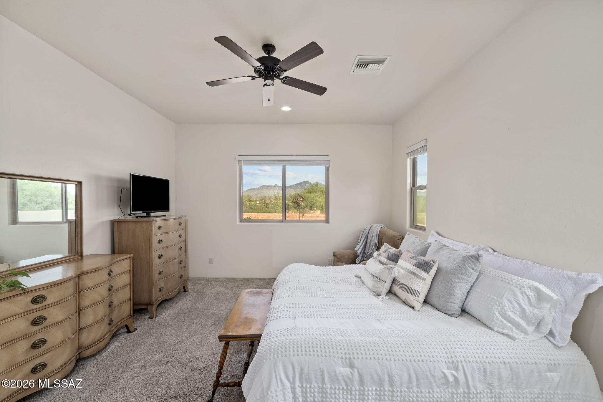 45 High View Court Tubac, AZ 85646 - Photo 30 of 44 a bedroom with a balcony a bed and flat screen tv
