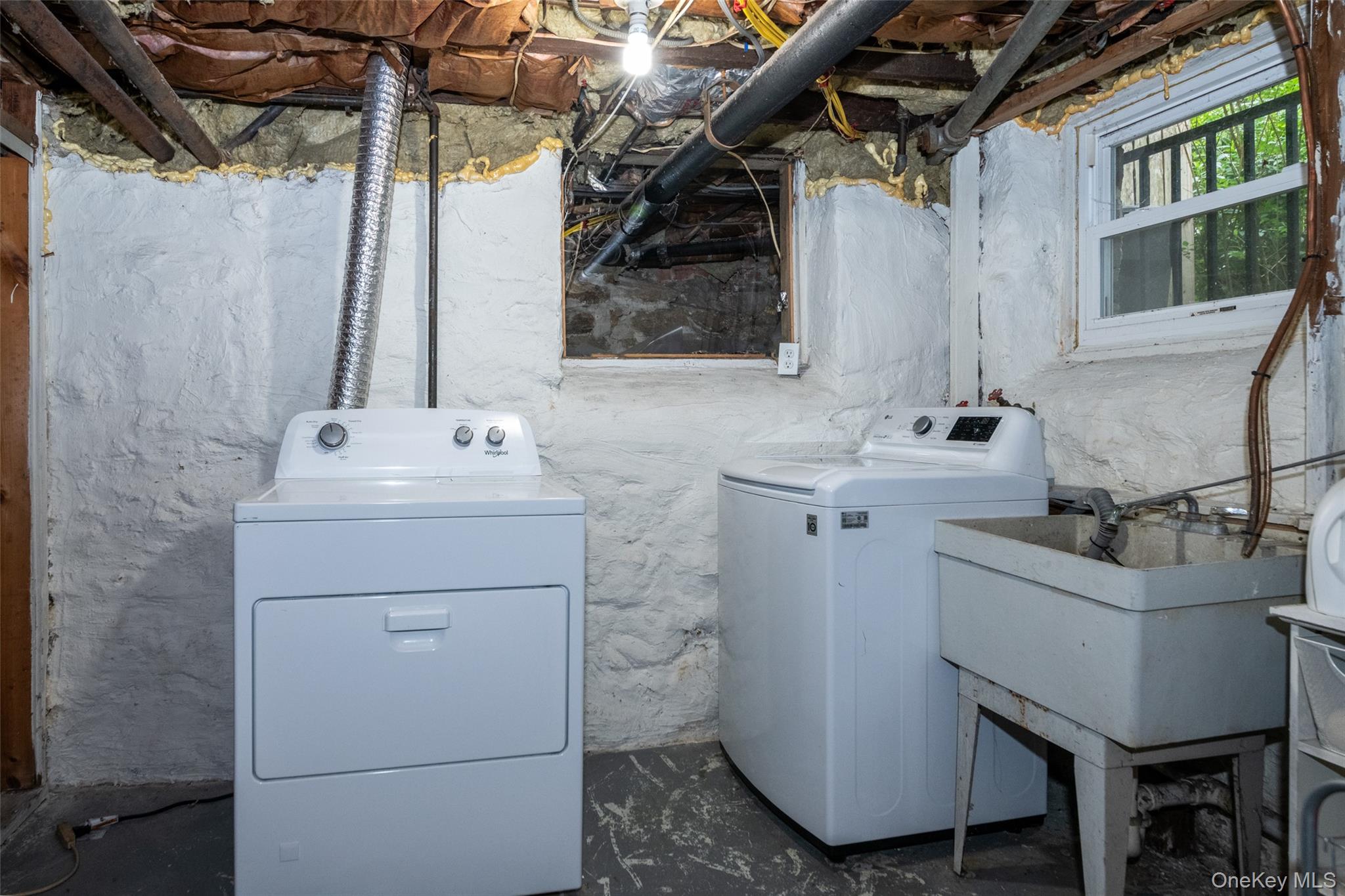 82 Clove Road New Rochelle, NY 10801 - Photo 32 of 39 a bathroom with a sink toilet and mirror