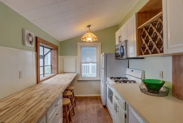 a kitchen with a table and chairs