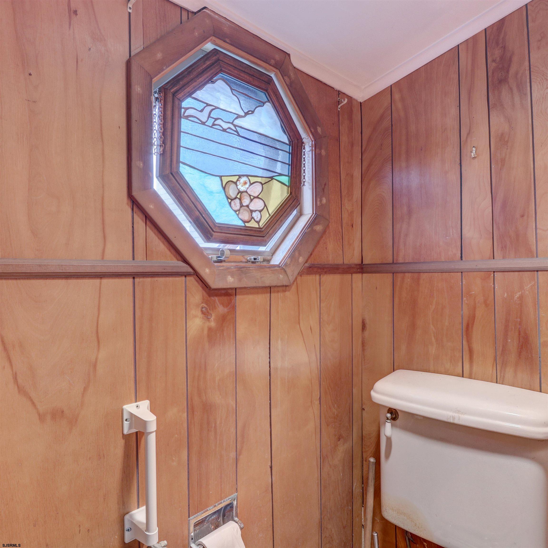 22 South Decatur Avenue, Unit 1ST HALF '26 Margate City, NJ 08402 - Photo 23 of 28 a bathroom with a toilet and a sink