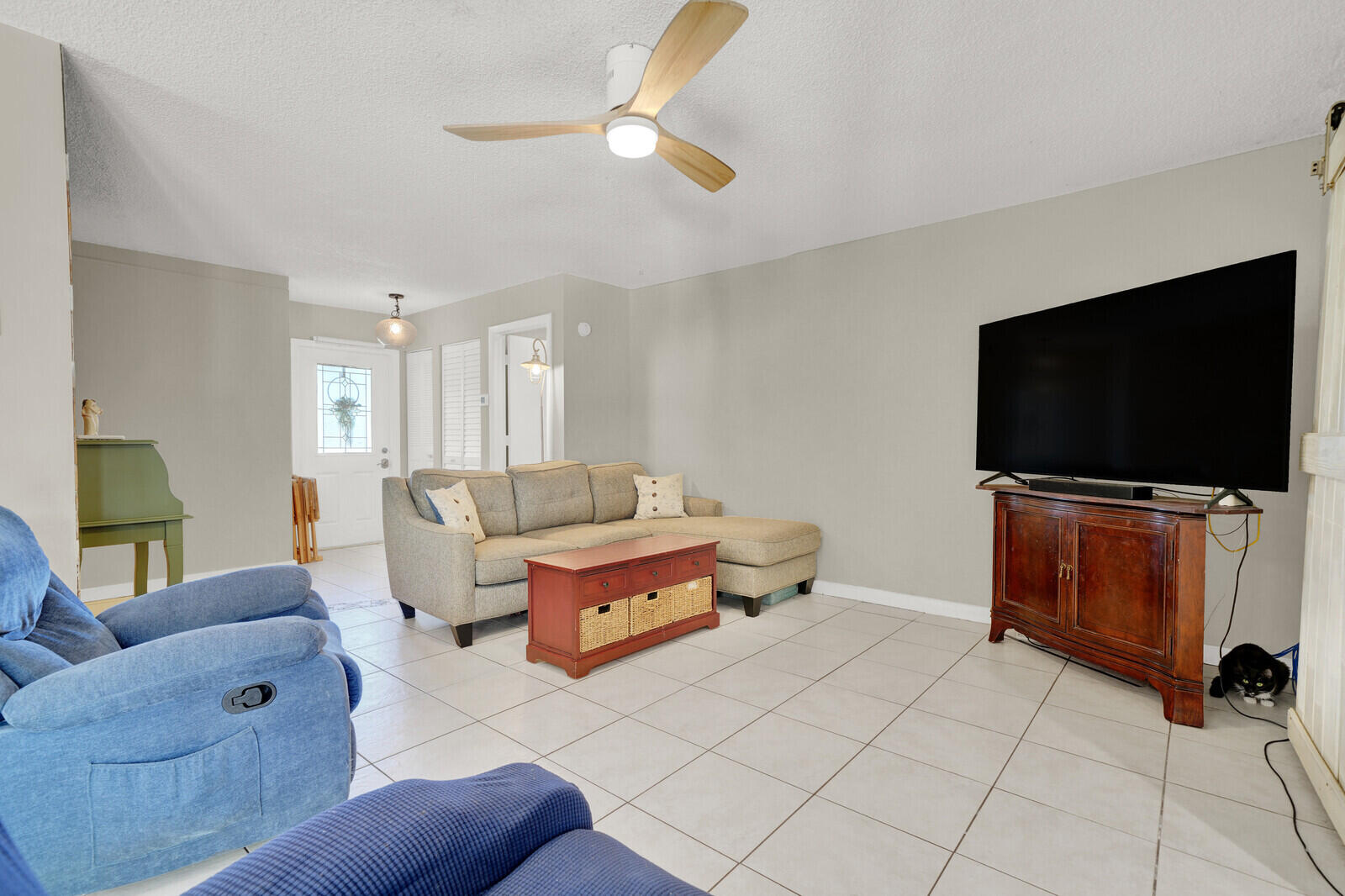 10406 Sleepy Brook Way Boca Raton, FL 33428 - Photo 12 of 36 a living room with furniture and a flat screen tv