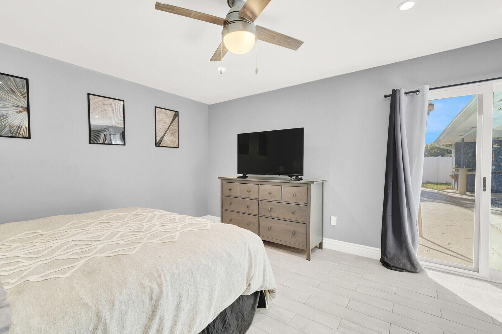 10406 Sleepy Brook Way Boca Raton, FL 33428 - Photo 18 of 36 a bedroom with a bed and a flat screen tv