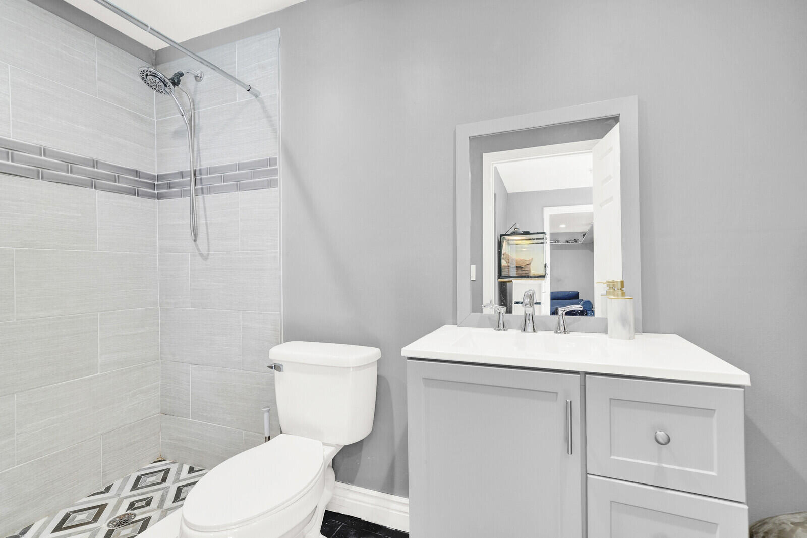 10406 Sleepy Brook Way Boca Raton, FL 33428 - Photo 19 of 36 a bathroom with a sink toilet and shower