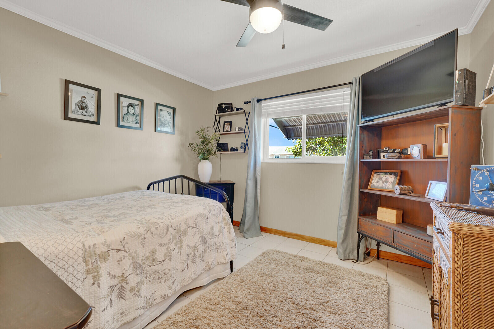 10406 Sleepy Brook Way Boca Raton, FL 33428 - Photo 20 of 36 a bedroom with a large bed and a chandelier