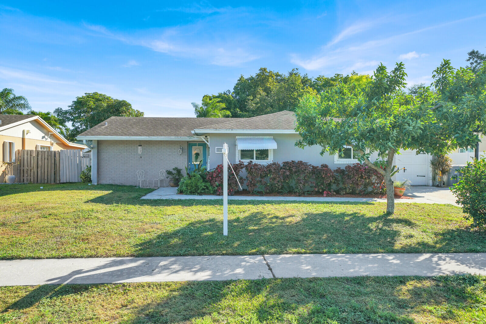 10406 Sleepy Brook Way Boca Raton, FL 33428 - Photo 2 of 36 a view of a house with pool and a yard