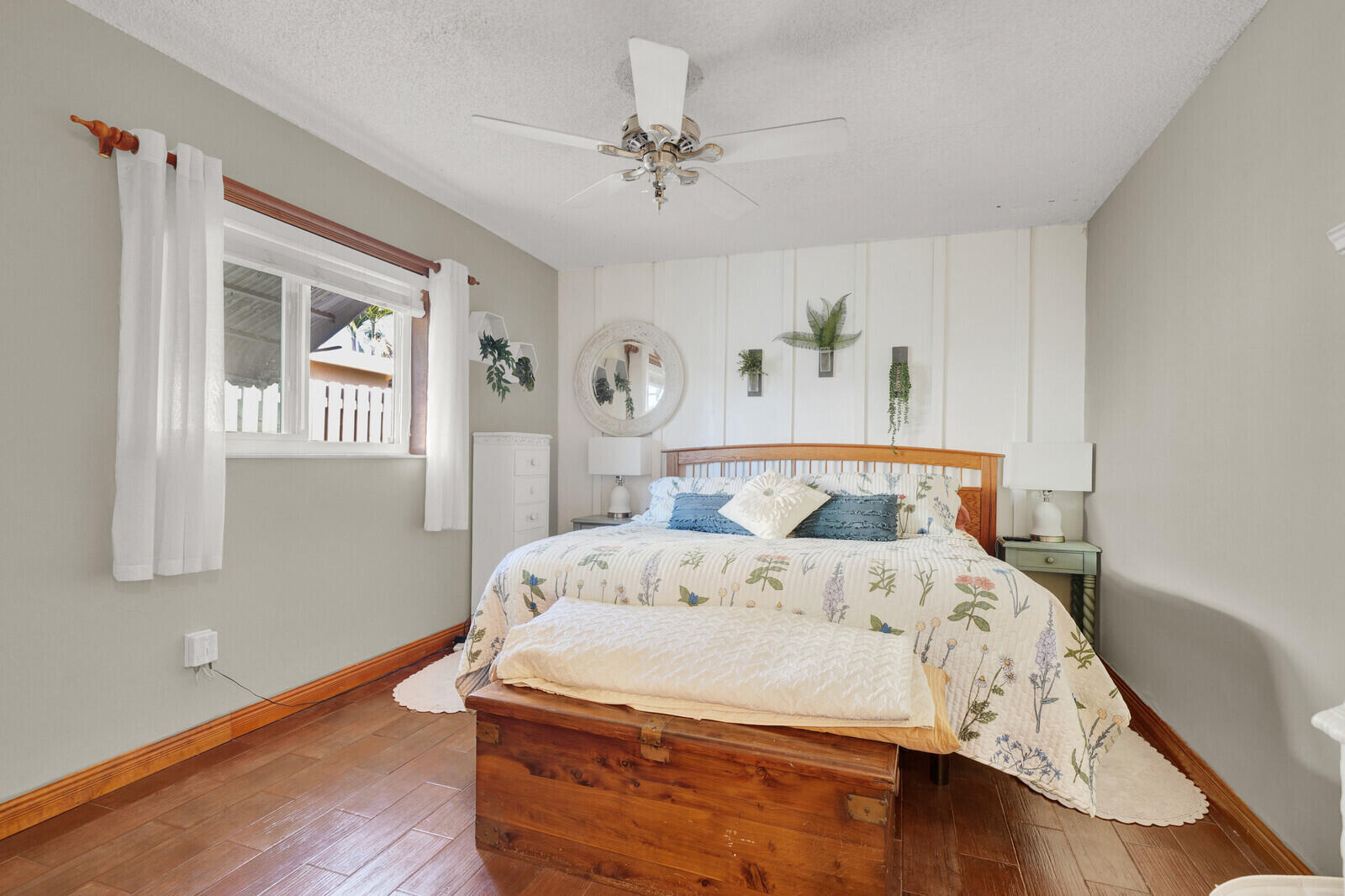 10406 Sleepy Brook Way Boca Raton, FL 33428 - Photo 24 of 36 a bedroom with a large bed and a chandelier