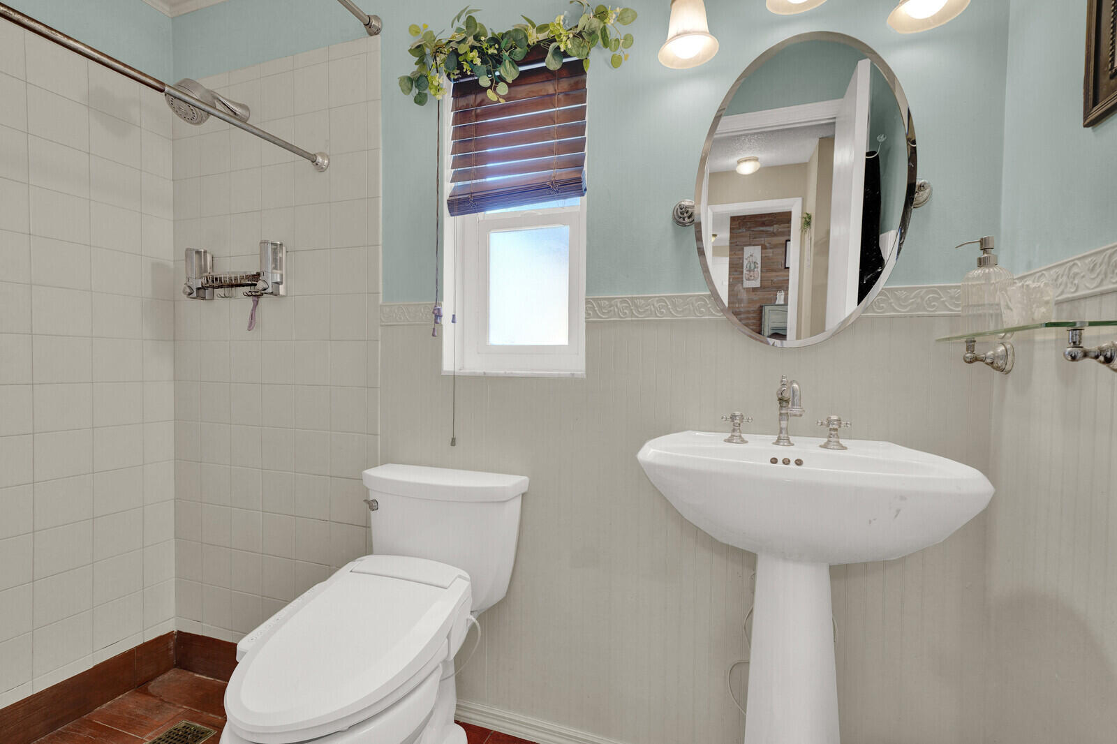 10406 Sleepy Brook Way Boca Raton, FL 33428 - Photo 27 of 36 a bathroom with a toilet sink and mirror