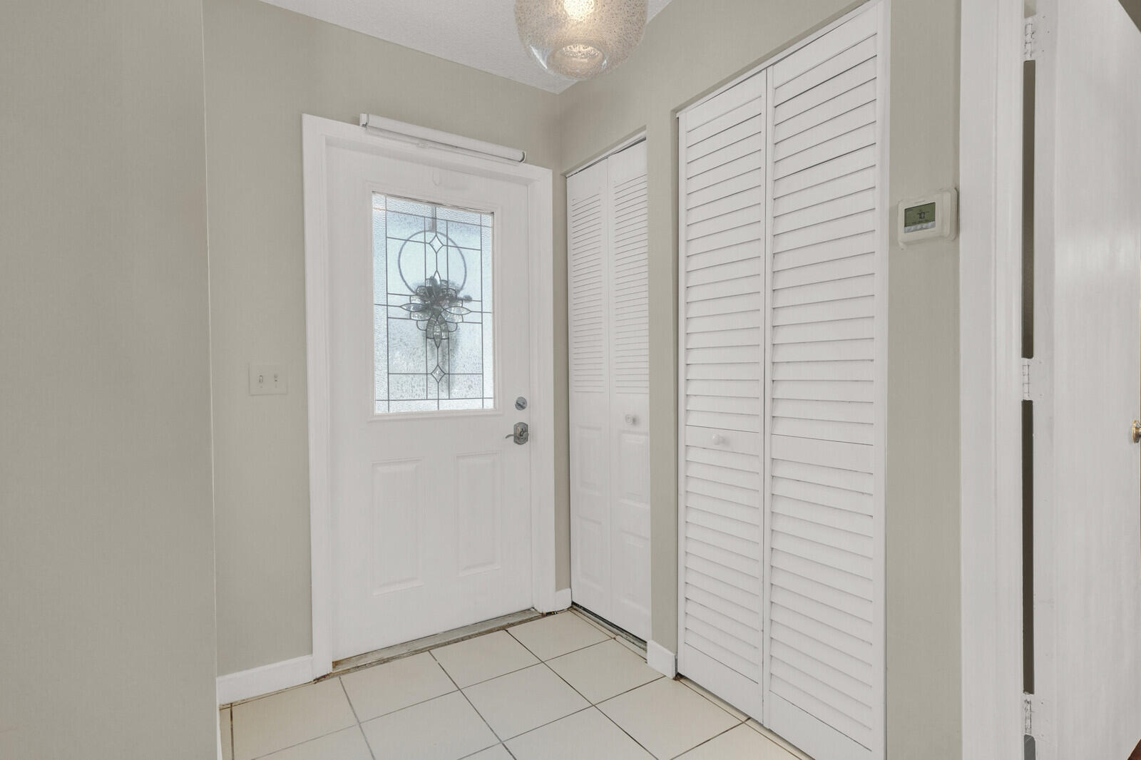 10406 Sleepy Brook Way Boca Raton, FL 33428 - Photo 5 of 36 a view of an empty room with window