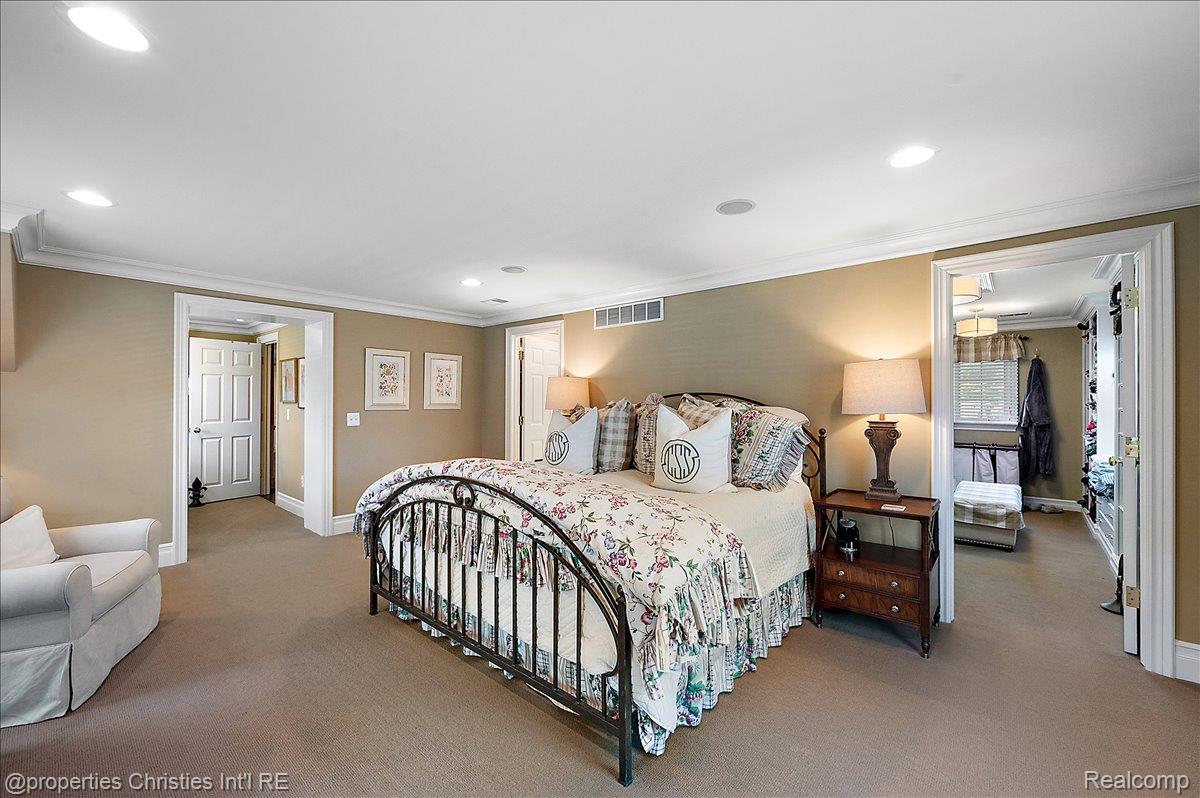 135 Clifton Road Bloomfield Hills, MI 48301 - Photo 35 of 77 Carpeted interior with crown molding and recessed lighting