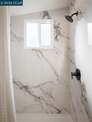 a view of a bathroom with a bathtub