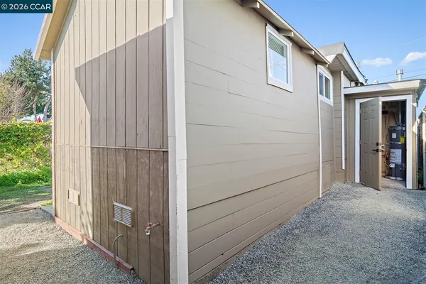 a view of a house with a backyard