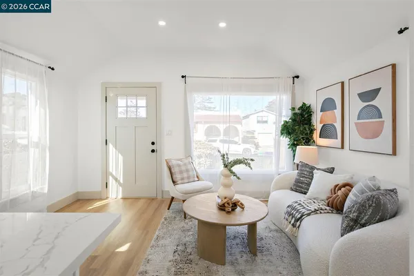 a living room with furniture and a large window