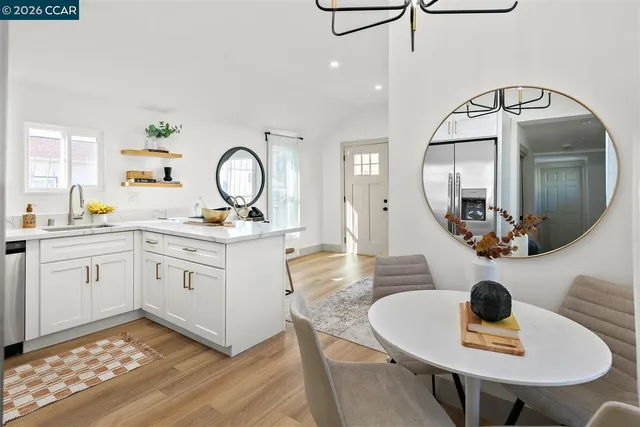 a kitchen with a sink cabinets and window