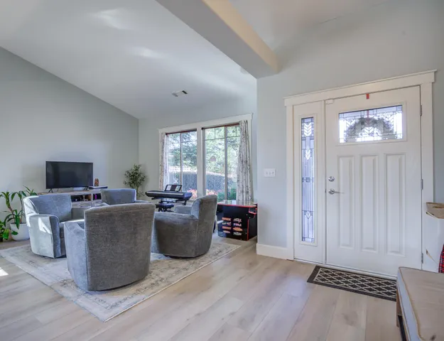 a large kitchen with stainless steel appliances granite countertop a large stove a sink dishwasher and cabinets with wooden floor