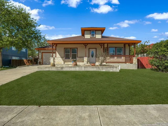 a front view of house with yard and seating area