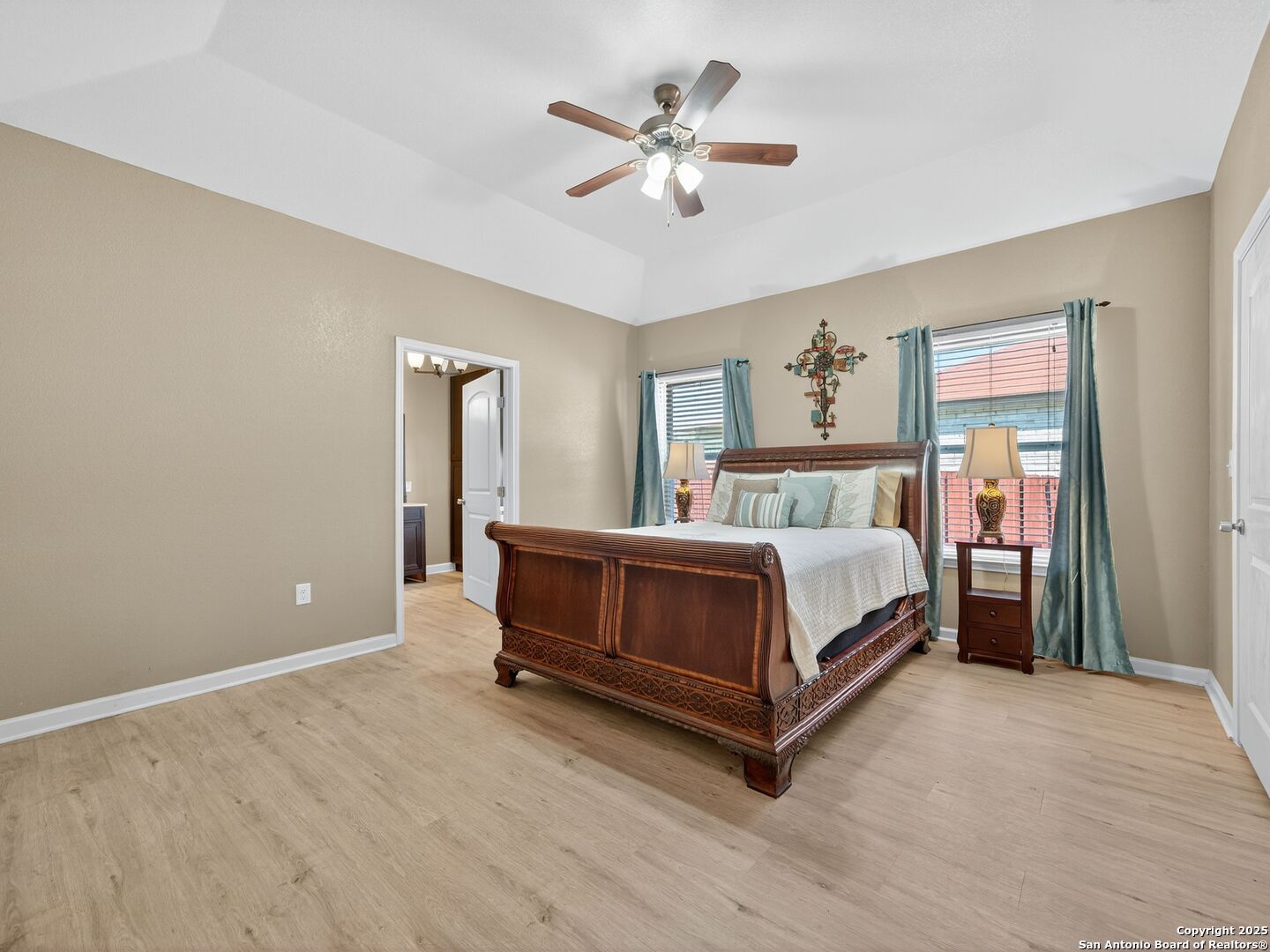 605 Meadow Gate Converse, TX 78109 - Photo 16 of 27 a bedroom with a bed and a ceiling fan
