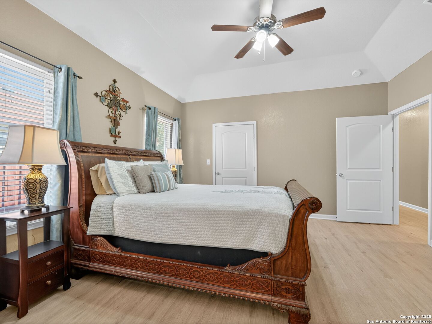 605 Meadow Gate Converse, TX 78109 - Photo 18 of 27 a bedroom with a bed and wooden floor