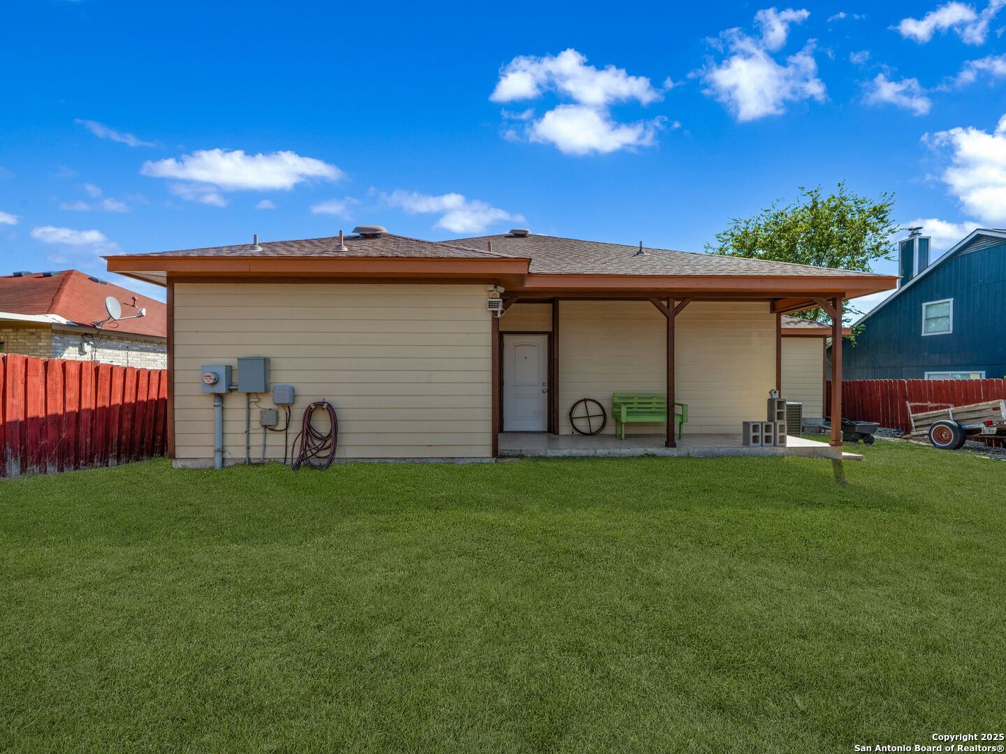 605 Meadow Gate Converse, TX 78109 - Photo 25 of 27 a backyard of a house with table and chairs