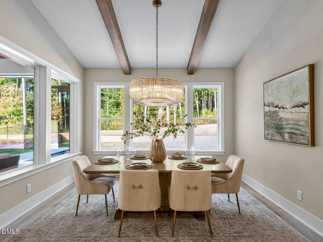 1309 Montvale Ridge Drive Cary, NC 27519 - Photo 12 of 24 a dining room with furniture a chandelier and wooden floor
