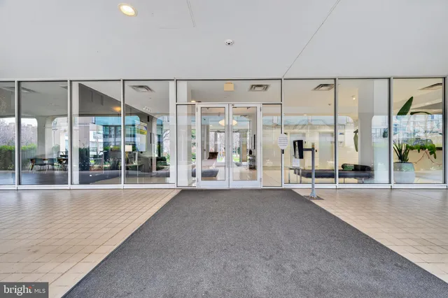 a big room with windows and view of living room