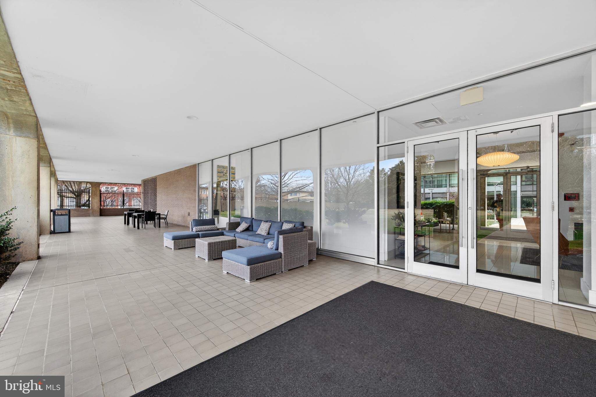 1101 3rd Street Southwest, Unit 503 Washington, DC 20024 - Photo 26 of 29 a living room with furniture and a large window with outer view