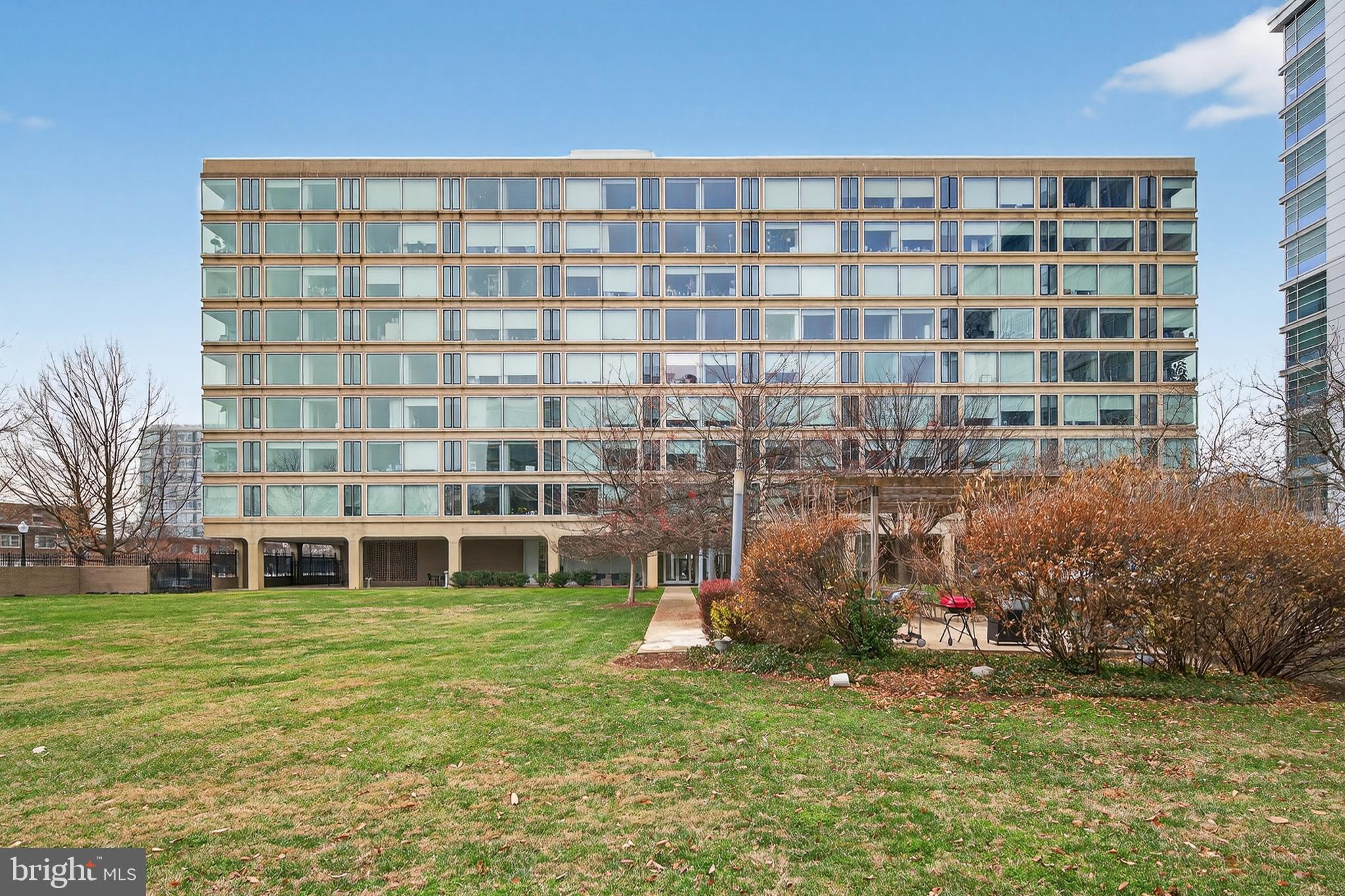 1101 3rd Street Southwest, Unit 503 Washington, DC 20024 - Photo 28 of 29 a large building with a yard