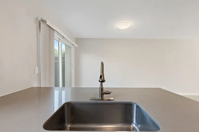 a bathroom with a sink and a window