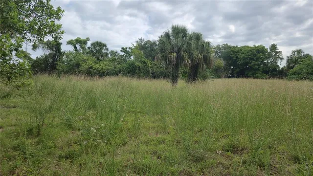 a view of a lake with houses in the back