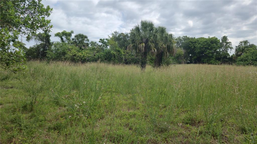Villa Drive Hudson, FL 34667 - Photo 10 of 11 a view of a lake with houses in the back