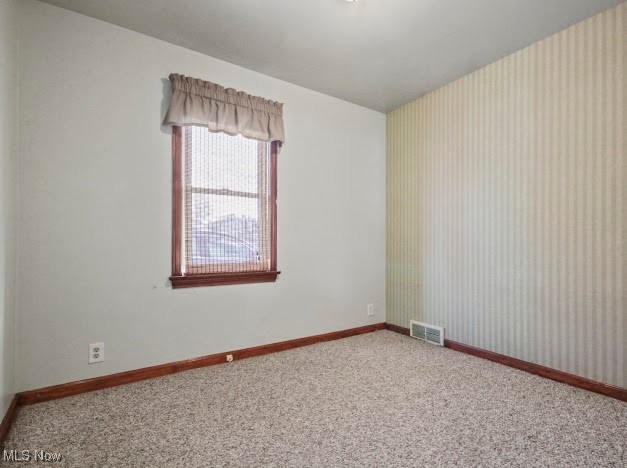 284 Wilson Street Struthers, OH 44471 - Photo 12 of 16 Carpeted empty room featuring baseboards