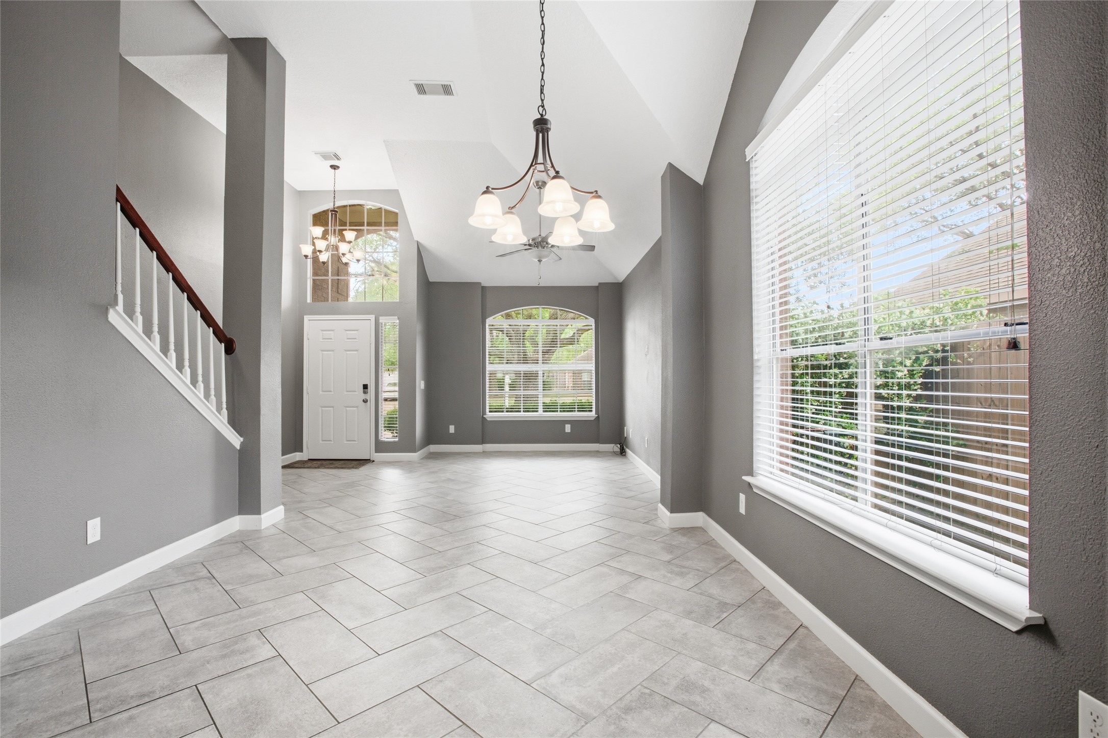 20907 Nettlebrook Lane Katy, TX 77450 - Photo 11 of 46 The dining room carries a sense of occasion without feeling formal. A custom chandelier anchors the space, while natural light keeps it feeling easy and relaxed. It’s where weeknight dinners can stretch into conversations that linger.