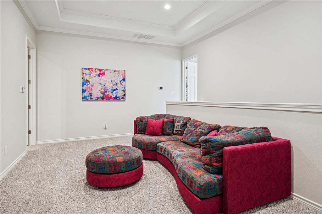 9545 Milltrail Drive Dallas, TX 75238 - Photo 20 of 30 a living room with furniture and a rug