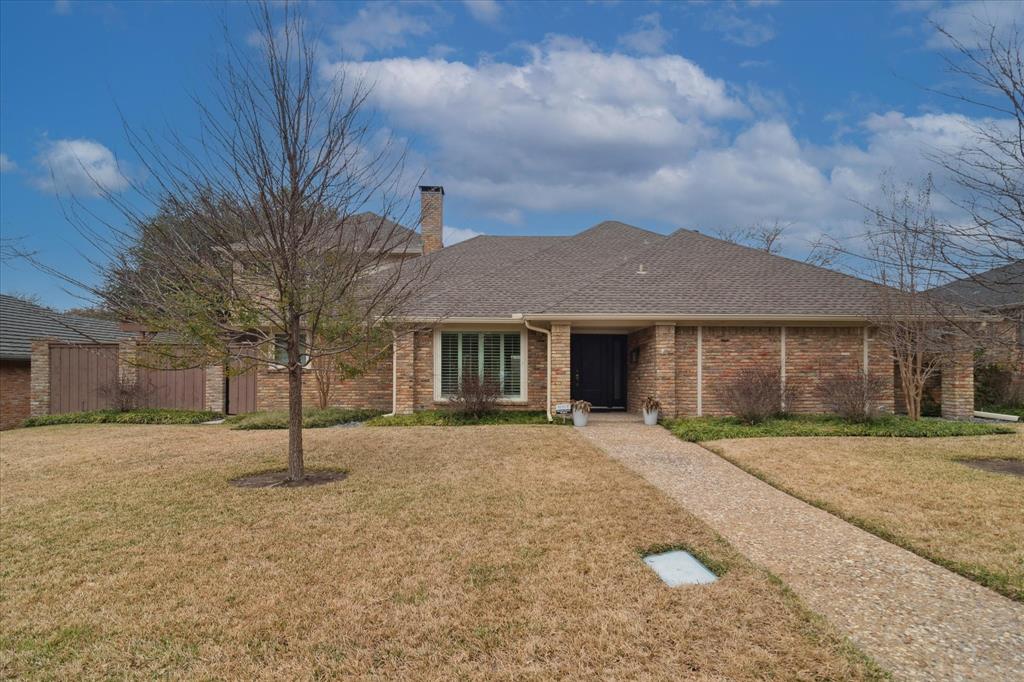 9545 Milltrail Drive Dallas, TX 75238 - Photo 29 of 30 a front view of a house with a yard