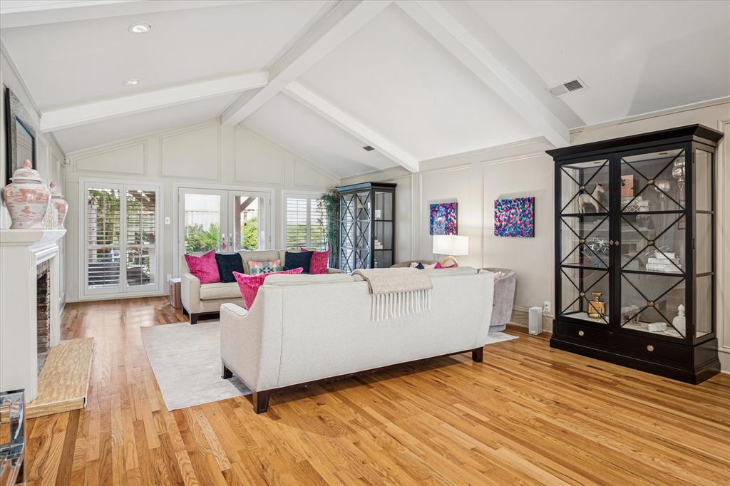 9545 Milltrail Drive Dallas, TX 75238 - Photo 7 of 30 a living room with furniture and a wooden floor