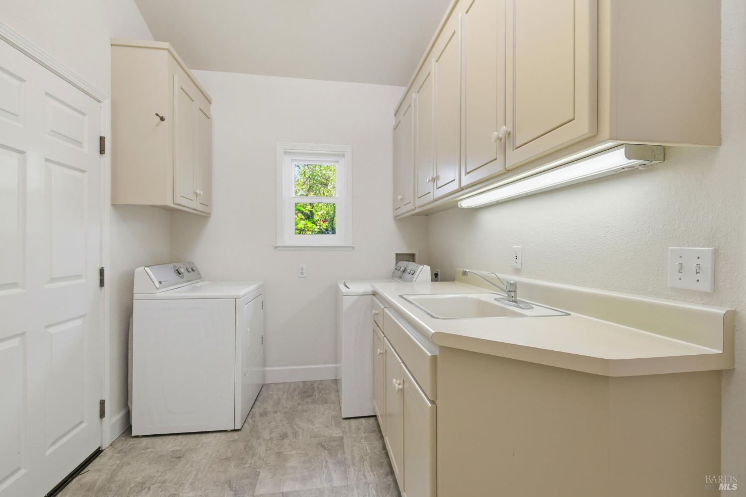 3223 Canfield Road Sebastopol, CA 95472 - Photo 30 of 58 Laundry Room with Sink and Generous Cabinets