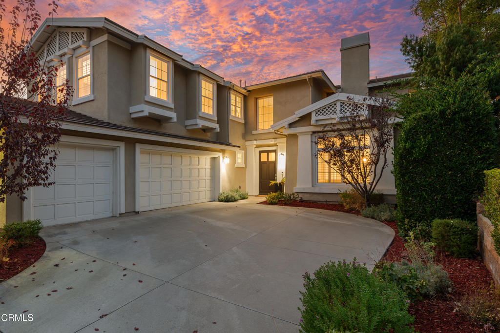a front view of a house with a garage
