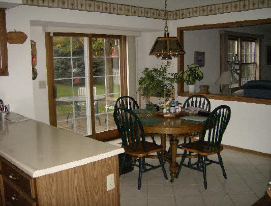 6835 Sentinel Road Rockford, IL 61107 - Photo 3 of 6 a dining room with furniture and window