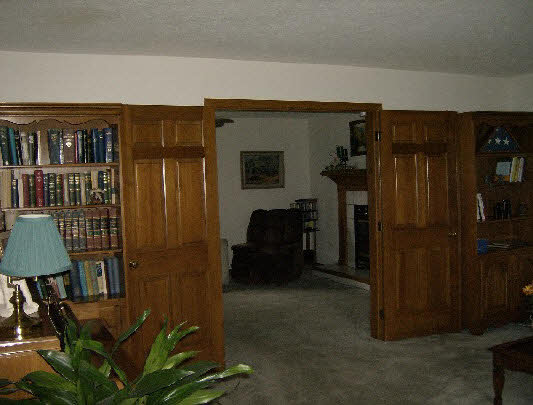 6835 Sentinel Road Rockford, IL 61107 - Photo 5 of 6 a living room with furniture a lamp and a closet