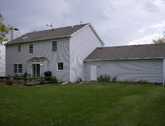 6835 Sentinel Road Rockford, IL 61107 - Photo 6 of 6 a view of a house with a yard and sitting area