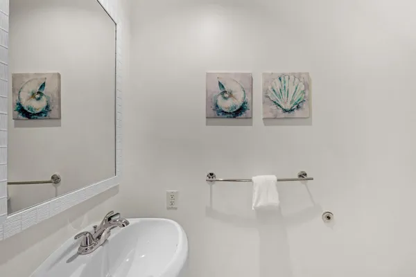 a bathroom with a sink and mirror