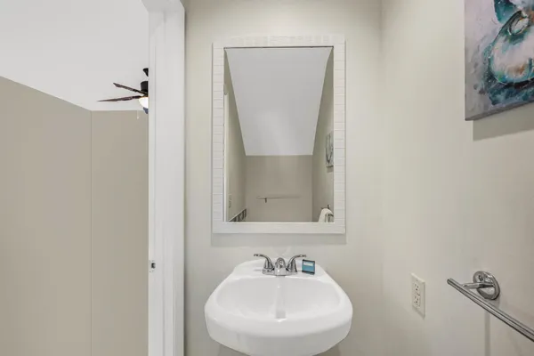 a bathroom with a sink a mirror and shower