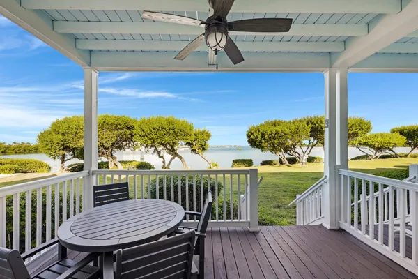a view of a balcony with wooden floor