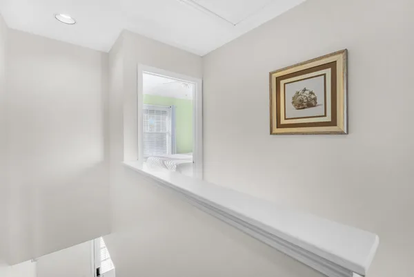 a bathroom with a toilet and a window