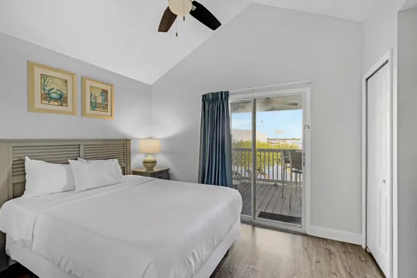 a bedroom with a balcony and a bed