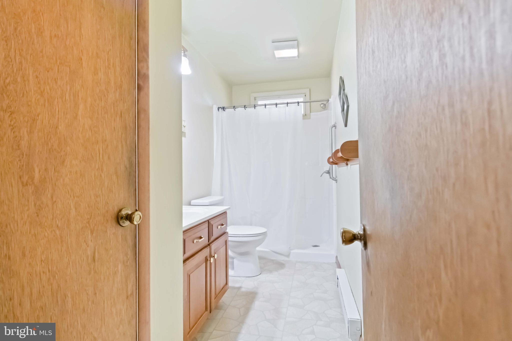 6216 Blue Grass Avenue Harrisburg, PA 17112 - Photo 12 of 23 a bathroom with a shower and a toilet